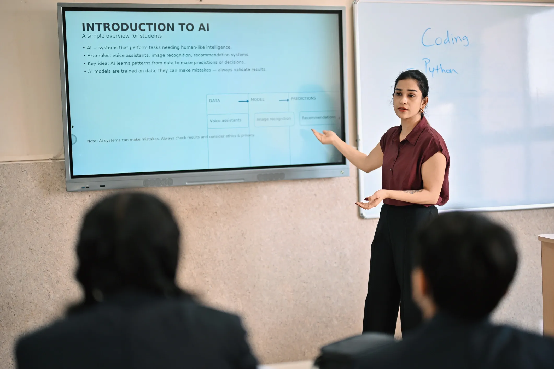 An educator explaining AI concepts on a classroom display — data, models, and predictions made simple